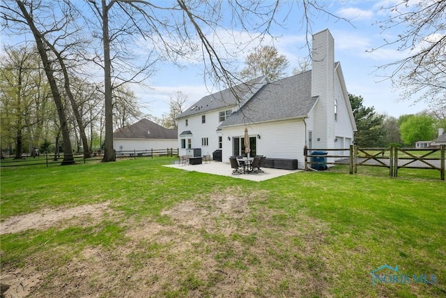 1135 Pimlico Park, Holland, OH 43528 - back of property with roof with shingles, a fenced backyard, a chimney, a patio area, and a lawn