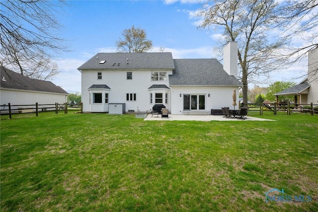 1135 Pimlico Park, Holland, OH 43528 - back of house featuring a patio, a fenced backyard, a lawn, and a chimney