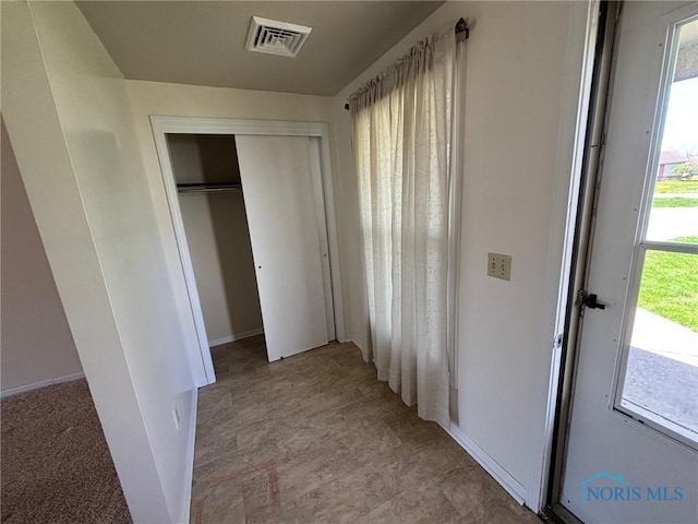 interior space with visible vents and baseboards