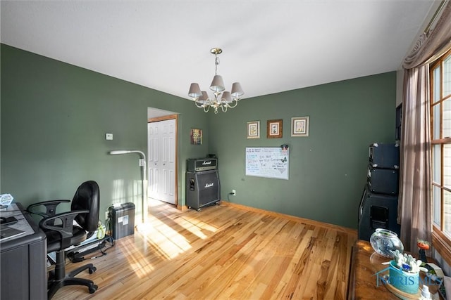 2515 S Berkey Southern Rd, Swanton, OH 43558 - office space featuring light wood-style floors, a chandelier, and baseboards