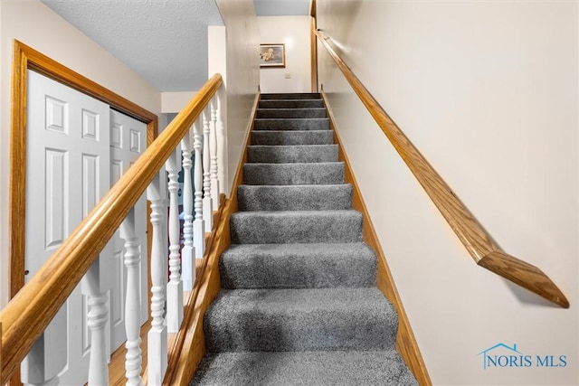2515 S Berkey Southern Rd, Swanton, OH 43558 - stairs with a textured ceiling