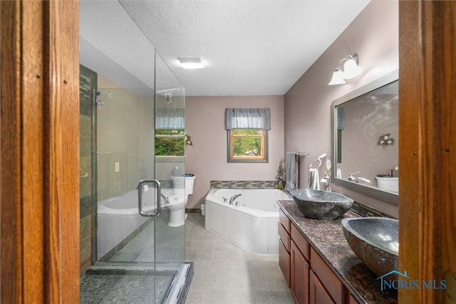2515 S Berkey Southern Rd, Swanton, OH 43558 - full bathroom with a bath, a stall shower, a textured ceiling, and double vanity