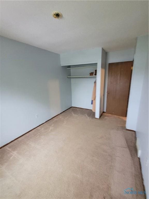 633 Southfield Dr, Maumee, OH 43537 - unfurnished bedroom featuring light colored carpet and a closet