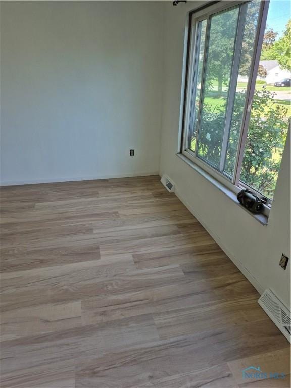633 Southfield Dr, Maumee, OH 43537 - unfurnished room with light wood-style floors and baseboards