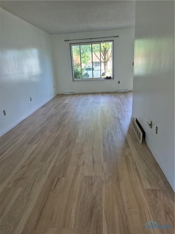 633 Southfield Dr, Maumee, OH 43537 - spare room with wood finished floors and baseboards