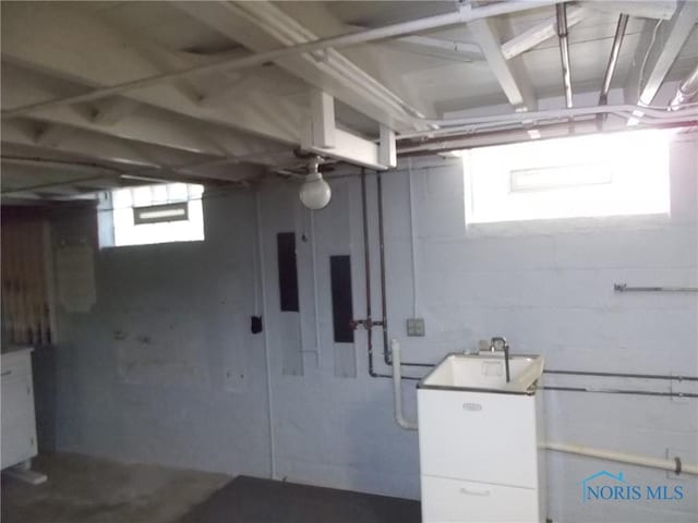below grade area with a sink
