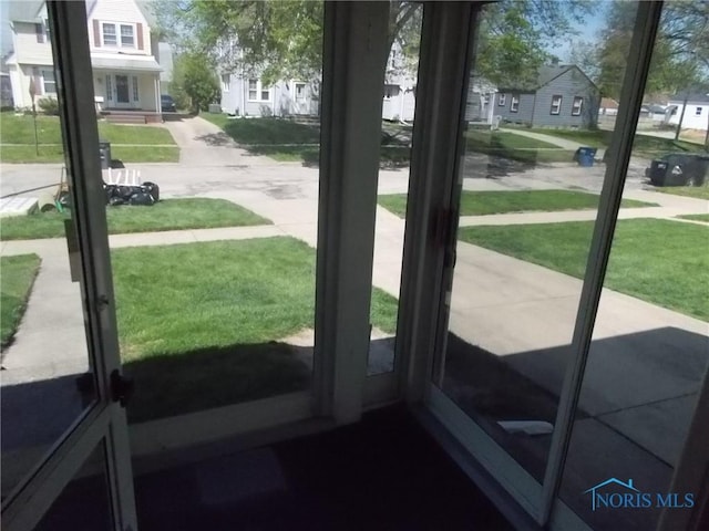 doorway to outside with a residential view