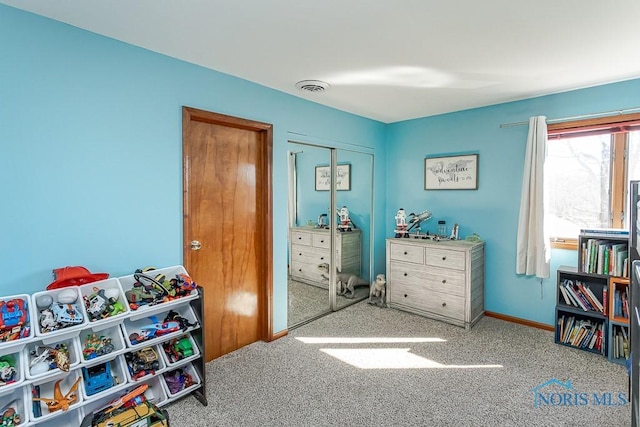 rec room featuring carpet flooring, baseboards, and visible vents
