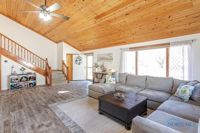 living room with a ceiling fan, wood finished floors, lofted ceiling, wood ceiling, and stairway