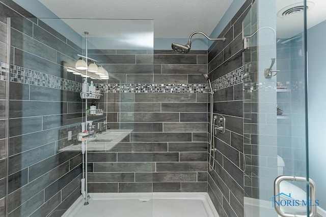 full bath featuring visible vents and a shower stall