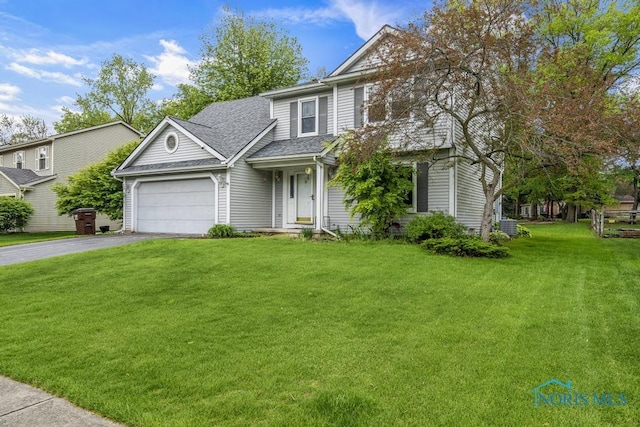 3739 Wild Pheasant Ln, Sylvania, OH 43560 - traditional-style house with driveway, an attached garage, a shingled roof, and a front lawn