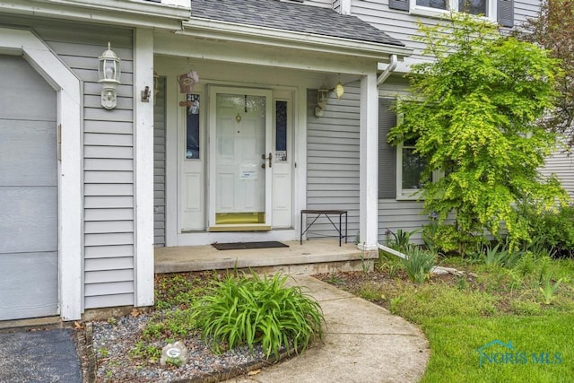 3739 Wild Pheasant Ln, Sylvania, OH 43560 - entrance to property featuring roof with shingles and a porch