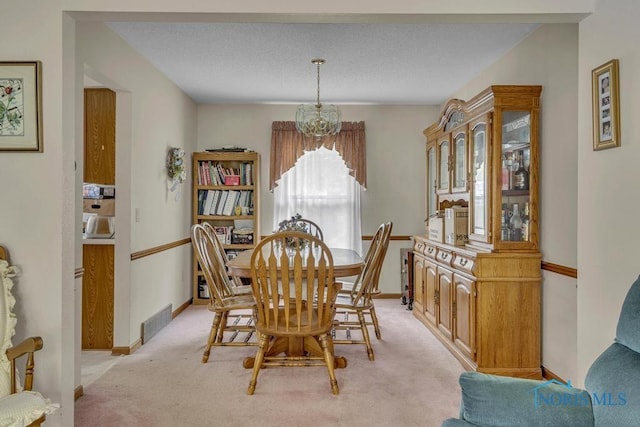 3739 Wild Pheasant Ln, Sylvania, OH 43560 - dining area with a chandelier, light carpet, and baseboards