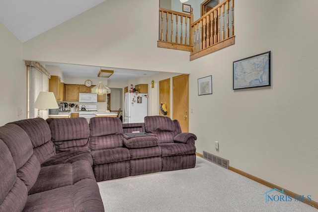 3739 Wild Pheasant Ln, Sylvania, OH 43560 - living area with high vaulted ceiling, carpet floors, and baseboards