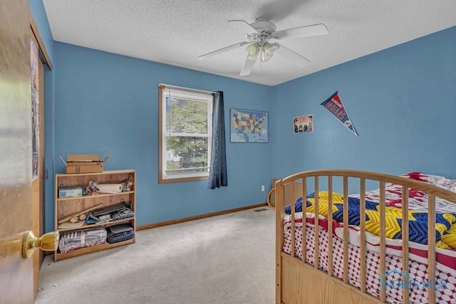 3739 Wild Pheasant Ln, Sylvania, OH 43560 - bedroom with carpet floors, a textured ceiling, baseboards, ceiling fan, and a closet