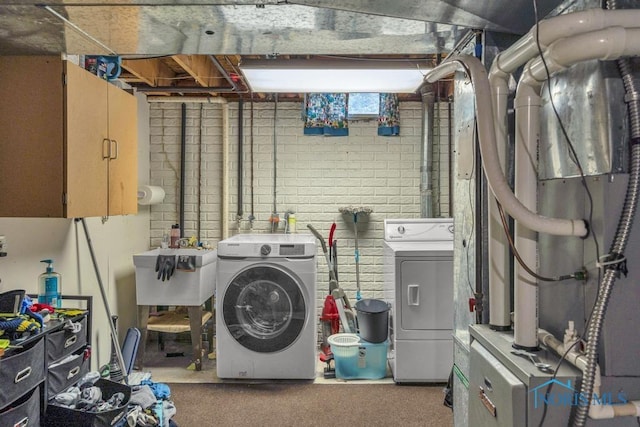 3739 Wild Pheasant Ln, Sylvania, OH 43560 - laundry area with separate washer and dryer and cabinet space