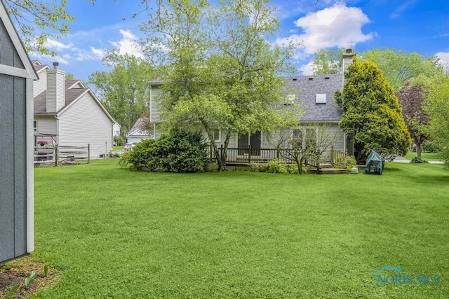 3739 Wild Pheasant Ln, Sylvania, OH 43560 - view of green lawn featuring a wooden deck