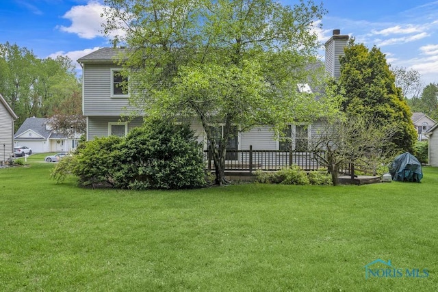 3739 Wild Pheasant Ln, Sylvania, OH 43560 - back of house with a yard and a chimney
