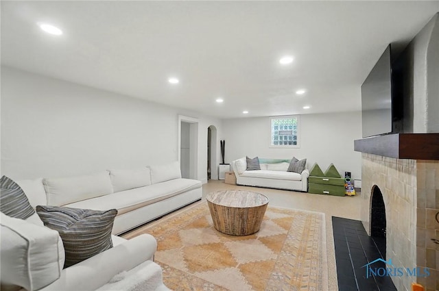 3405 Chestnut Hill Rd, Ottawa Hills, OH 43606 - living room featuring recessed lighting, arched walkways, and a fireplace