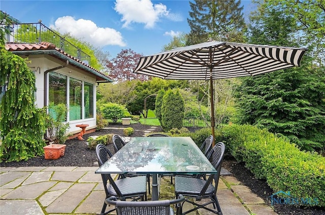 3405 Chestnut Hill Rd, Ottawa Hills, OH 43606 - view of patio featuring outdoor dining space and a sunroom