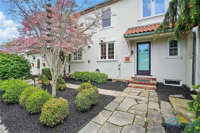 3405 Chestnut Hill Rd, Ottawa Hills, OH 43606 - entrance to property with a tiled roof and stucco siding