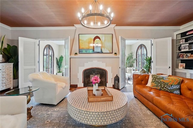 3405 Chestnut Hill Rd, Ottawa Hills, OH 43606 - living room featuring ornamental molding, a chandelier, a fireplace, and plenty of natural light