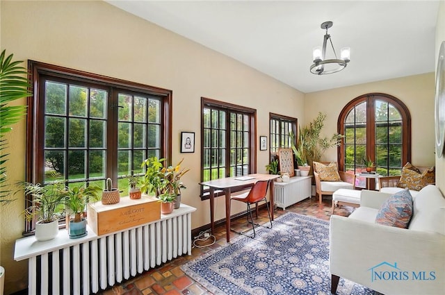 3405 Chestnut Hill Rd, Ottawa Hills, OH 43606 - sitting room with a chandelier, vaulted ceiling, and baseboards