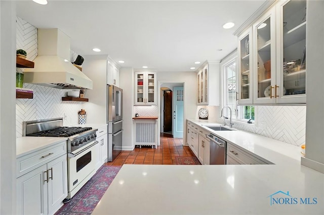 3405 Chestnut Hill Rd, Ottawa Hills, OH 43606 - kitchen featuring high end appliances, open shelves, a sink, decorative backsplash, and recessed lighting