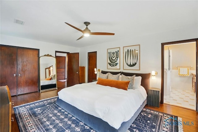 3405 Chestnut Hill Rd, Ottawa Hills, OH 43606 - bedroom featuring wood finished floors, two closets, a ceiling fan, and ensuite bathroom