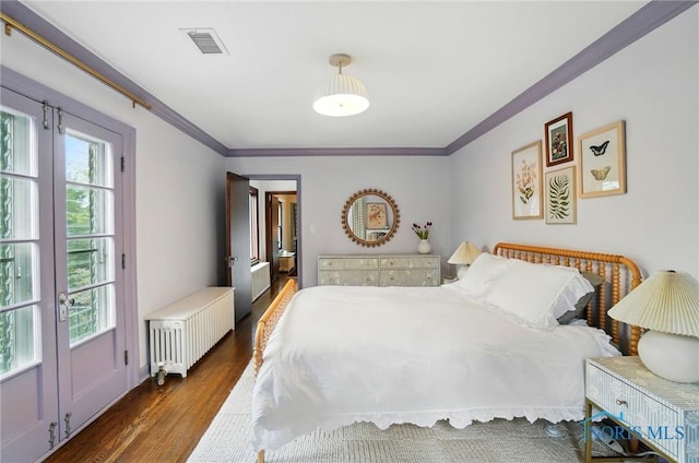 3405 Chestnut Hill Rd, Ottawa Hills, OH 43606 - bedroom featuring radiator heating unit, wood finished floors, ornamental molding, and multiple windows