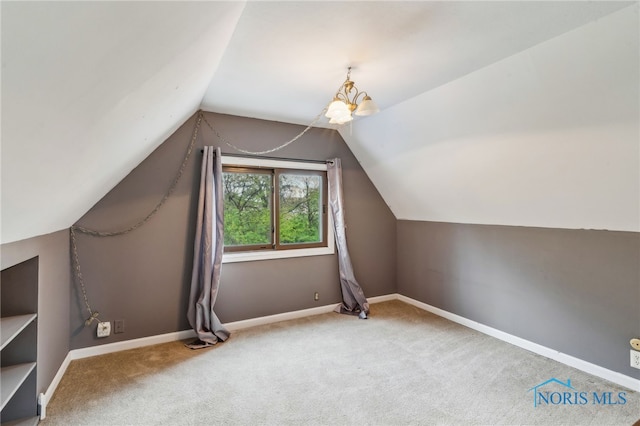bonus room featuring carpet floors, baseboards, and vaulted ceiling