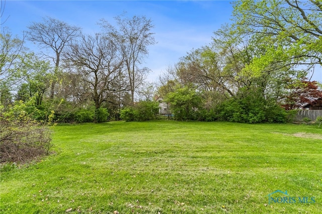 view of yard with fence