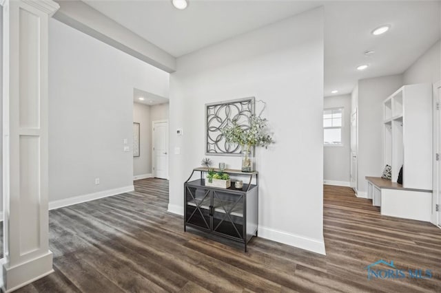 interior space featuring baseboards, recessed lighting, and dark wood-style flooring