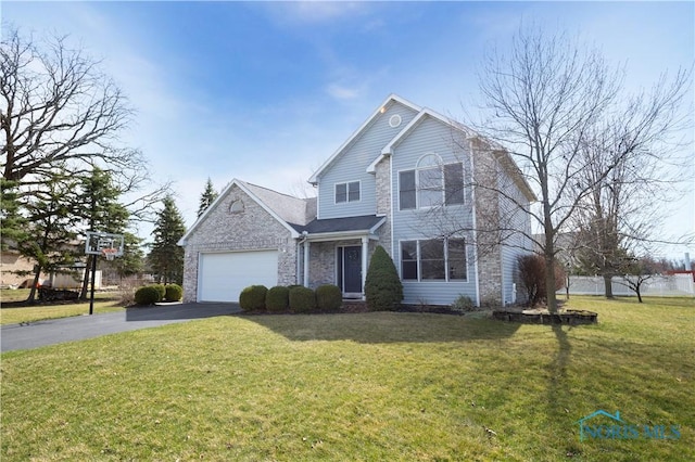 traditional-style house featuring a garage, stone siding, driveway, and a front yard