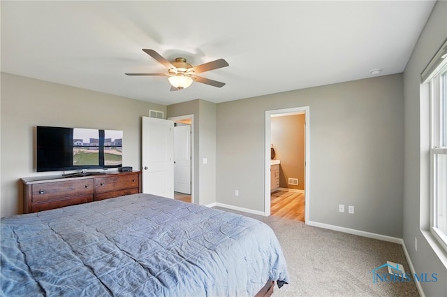 bedroom with carpet floors, baseboards, visible vents, and ceiling fan