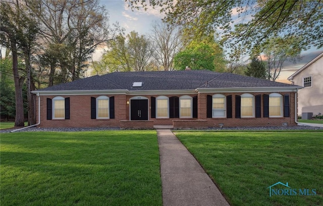 5258 Coldstream Rd, Toledo, OH 43623 - ranch-style home featuring a yard, brick siding, and roof with shingles