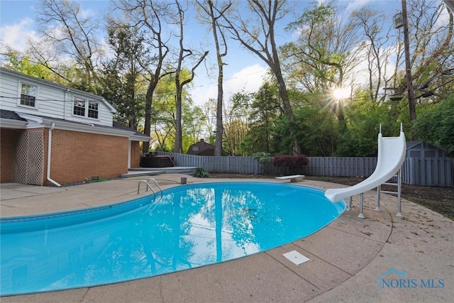 5258 Coldstream Rd, Toledo, OH 43623 - view of pool with a diving board, a fenced backyard, a water slide, and a patio area