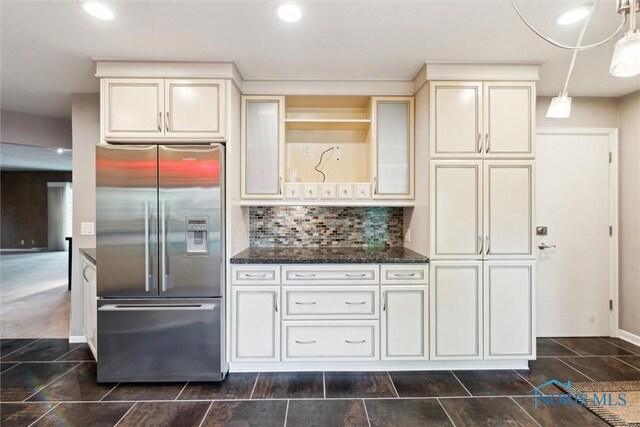 5258 Coldstream Rd, Toledo, OH 43623 - kitchen featuring high quality fridge, dark stone countertops, cream cabinetry, decorative backsplash, and recessed lighting