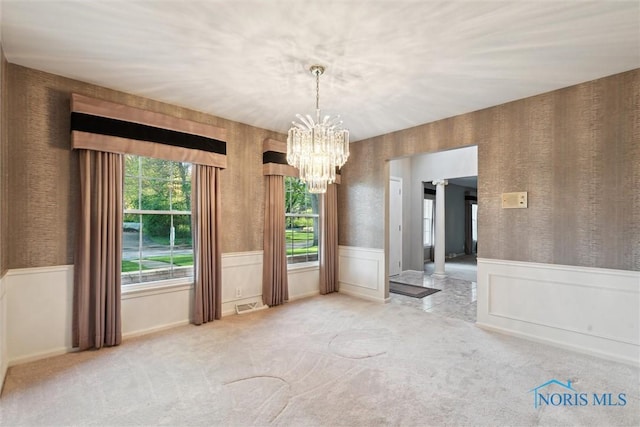 5258 Coldstream Rd, Toledo, OH 43623 - spare room with a wainscoted wall, a chandelier, and carpet floors