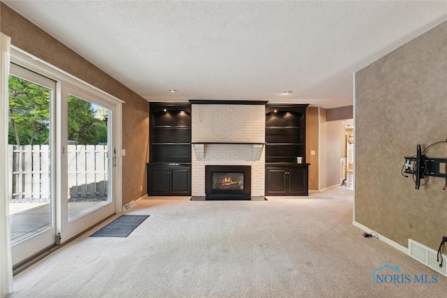 5258 Coldstream Rd, Toledo, OH 43623 - unfurnished living room featuring carpet floors, baseboards, a fireplace, and a textured ceiling