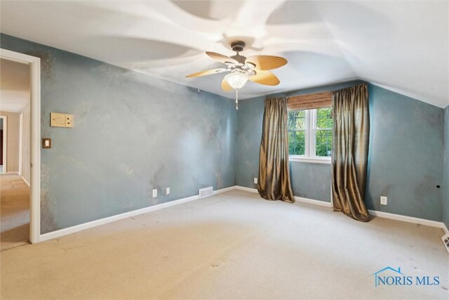 5258 Coldstream Rd, Toledo, OH 43623 - carpeted empty room with lofted ceiling, ceiling fan, and baseboards