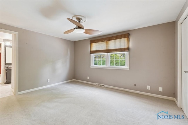 5258 Coldstream Rd, Toledo, OH 43623 - unfurnished bedroom with light colored carpet, baseboards, ensuite bath, and ceiling fan