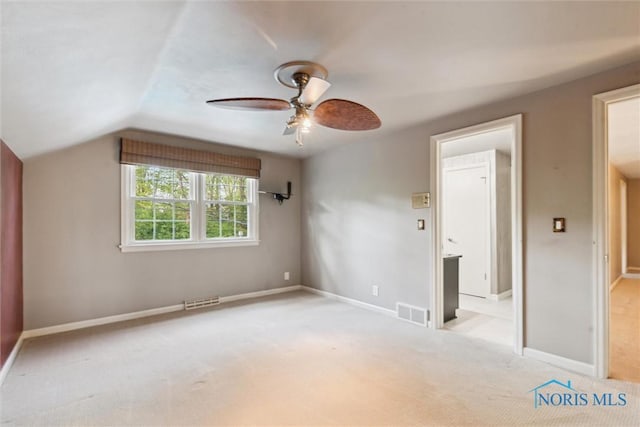 5258 Coldstream Rd, Toledo, OH 43623 - unfurnished bedroom with lofted ceiling, light colored carpet, baseboards, and a ceiling fan