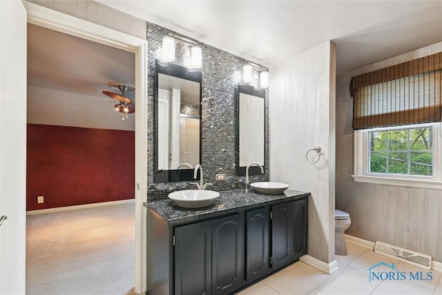 5258 Coldstream Rd, Toledo, OH 43623 - full bath featuring ceiling fan, toilet, baseboards, tile patterned flooring, and double vanity