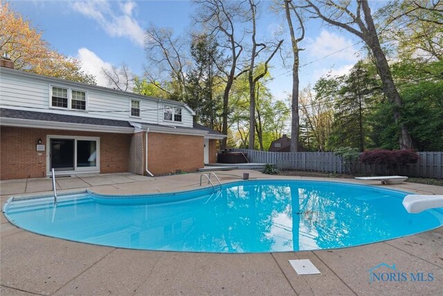 5258 Coldstream Rd, Toledo, OH 43623 - view of pool featuring a patio, a fenced backyard, and a diving board