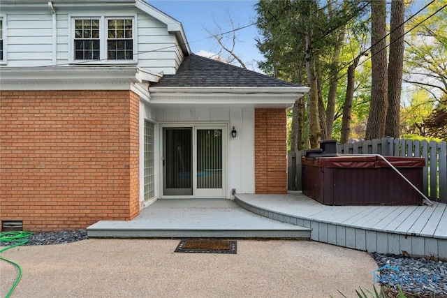5258 Coldstream Rd, Toledo, OH 43623 - entrance to property with brick siding, a hot tub, a shingled roof, and a patio