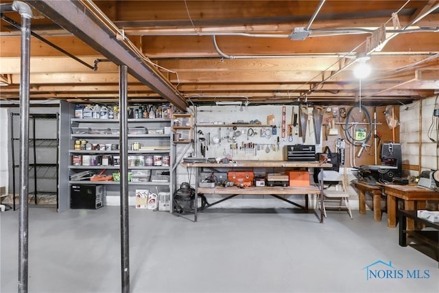 unfinished below grade area with a workshop area