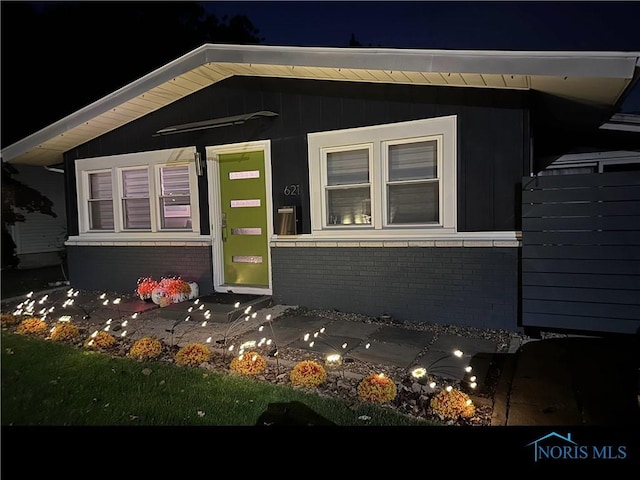 exterior space with brick siding