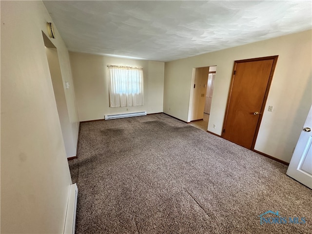 716 N Union St Unit B, Fostoria, OH 44830 - carpeted spare room featuring baseboards and a baseboard radiator