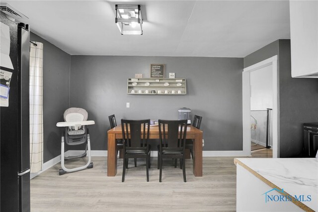 26237 Luckey Rd, Walbridge, OH 43465 - dining room featuring baseboards and light wood finished floors